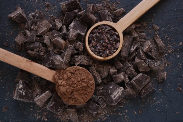 Chocolate chopped with cocoa powder and cacao nibs.